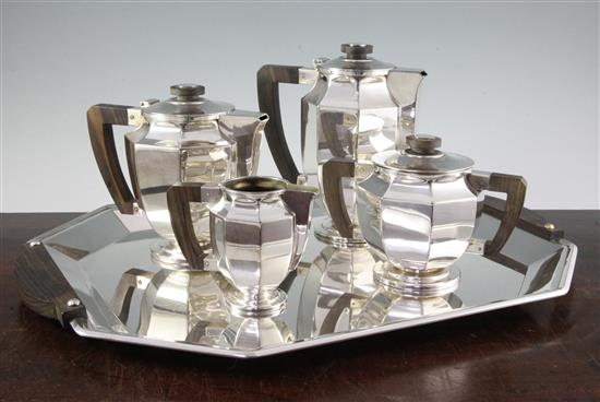 An Art Deco Christofle Gallia pattern five piece silver plated coromandel wood mounted tea and coffee set, tray 20in.